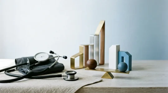 Professional editorial photograph showing medical screening tools and financial planning elements symbolizing cost-effective preventive healthcare investment