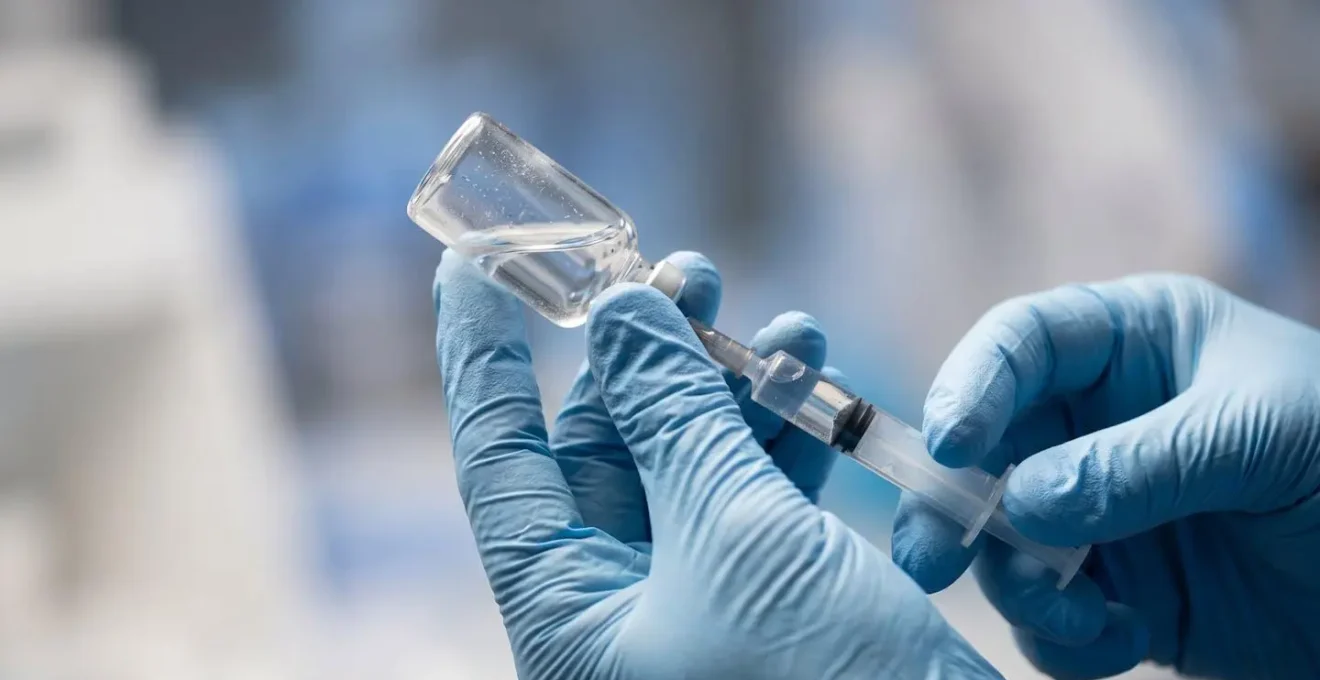 Medical professional preparing precise contrast administration in controlled clinical setting
